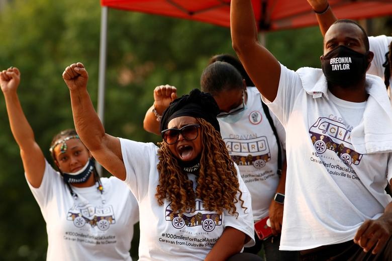 A delegation of people calling for justice for Breonna Taylor arrives from Louisville, Kentucky, and unites with the McClain family to protest police violence in the lead up to the one year anniversary of Elijah McClain's death in Denver, Colorado.   REUTERS/Kevin Mohatt  